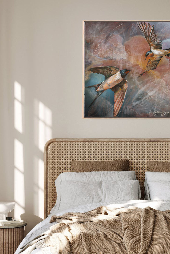Bedroom with a painting of birds above the bed