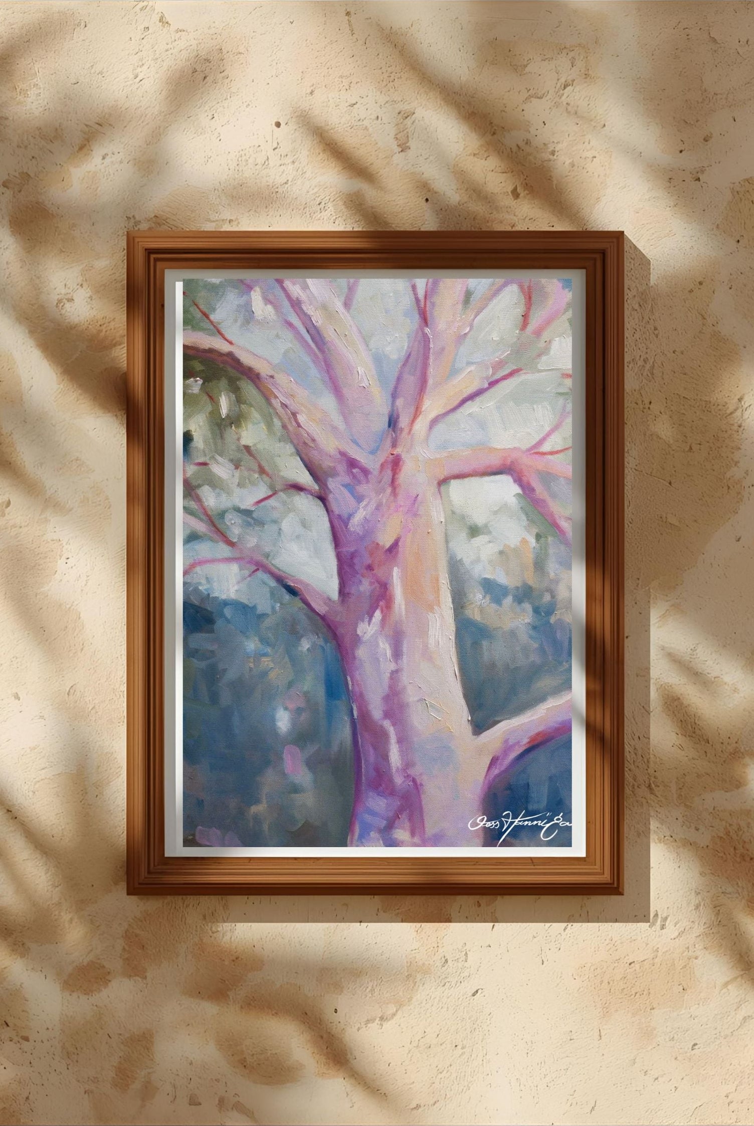 Framed painting of a tree with a colorful abstract design on a beige wall. Australian Artist Jesska Hannigan
