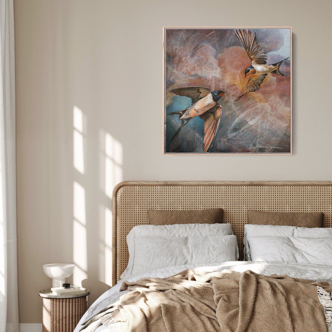 Bedroom with a painting of birds above the bed