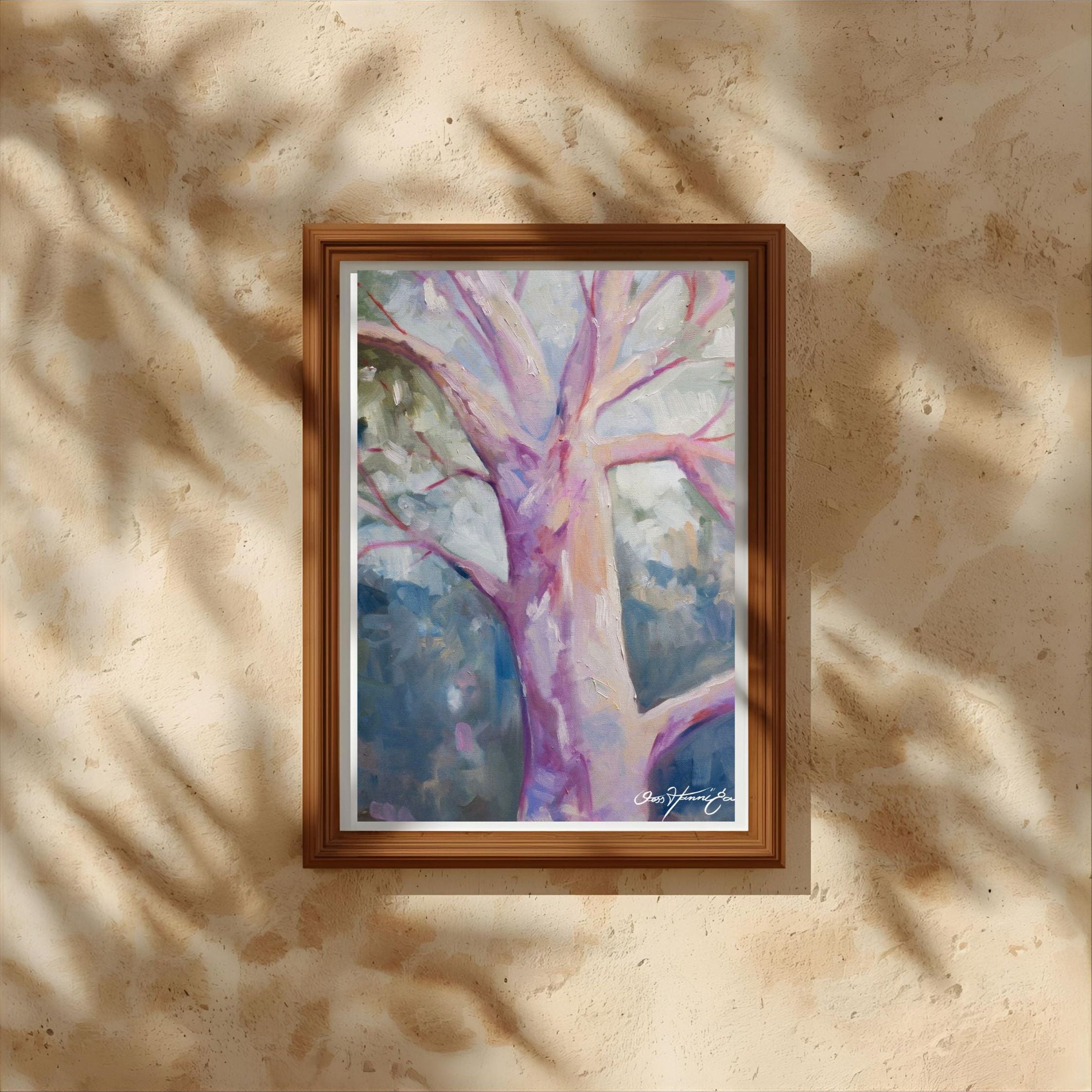 Framed painting of a tree with a colorful abstract design on a beige wall. Australian Artist Jesska Hannigan